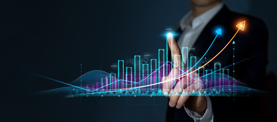 Businessman draws growing virtual hologram of statistics, graph and chart. Investment of growth on currency rate. Business strategy development and growing growth plan.