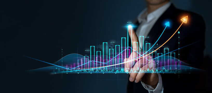 Businessman draws growing virtual hologram of statistics, graph and chart. Investment of growth on currency rate. Business strategy development and growing growth plan.