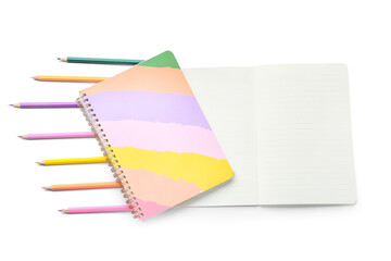 Composition with notebooks and color pencils on white background