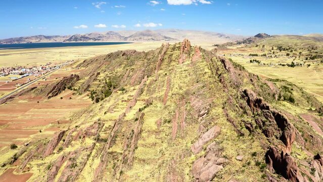 Flight above rock formations in Aramu Muru near Puno in Peru