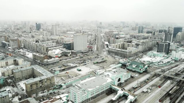 Horizontal panorama of the snow city from the quadcopter. Aerial photography of a winter city.