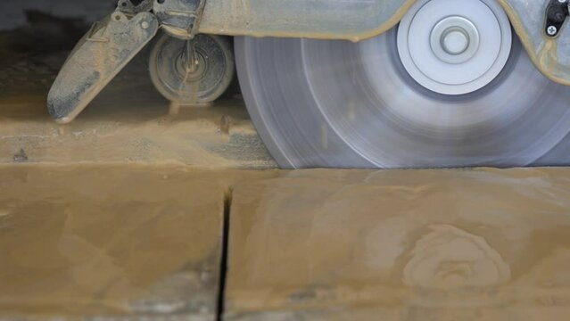 Using a wet saw to cut concrete on a construction project