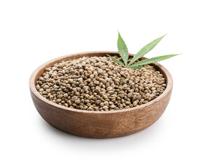 Plate with hemp seeds on white background