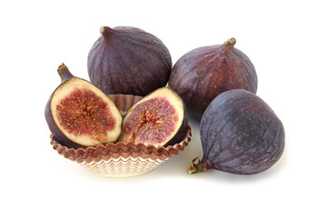 Three figs and slices isolated on white background