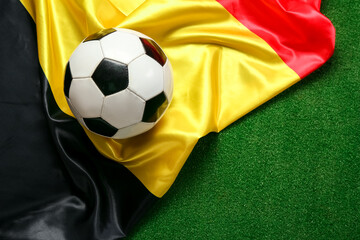 Soccer ball with Belgian flag on color background