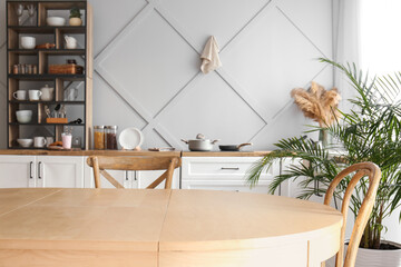 Empty dining table with chairs in modern kitchen
