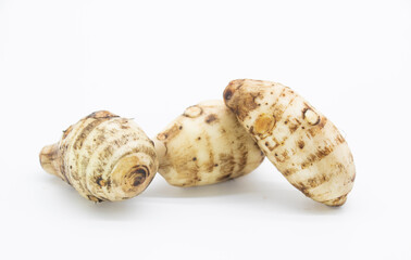 fresh taro root also known as Arbi on white background,