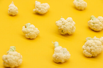 Cauliflower pieces isolated on yellow background, food, vegetable
