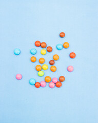 Colorful candies isolated on colored background