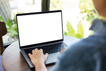 mock up empty screen notebook, businesswoman working on his laptop computer with blank space screen...