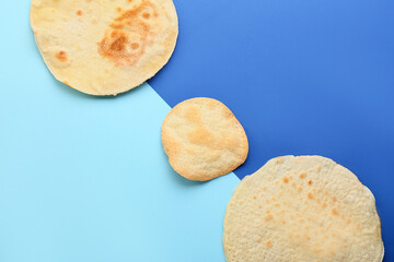 Jewish flatbread matza for Passover on blue background