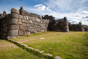 Beautiful view of the Saqsaywaman Inca archaeological site with large stone walls in Cusco, Peru