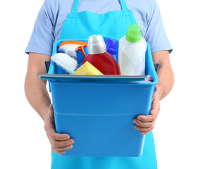 Mature worker of cleaning service with supplies on white background