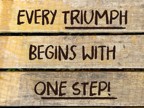 Every triumph begins with one step text background. Inspirational quote concept. Stock photo.