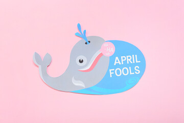 Card with text APRIL FOOLS on pink background