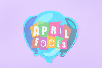 Greeting card with text APRIL FOOLS on color background