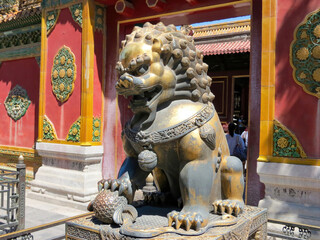 Bronze lion statue in The Forbidden City in Beijing, China © Ted17/Wirestock Creators
