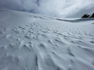 shapes, patterns and formations formed by the effect of the storm on high mountains