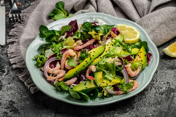 salad with fresh Avocado, Shrimps lettuce green mix and olive oil, lemon dressing. healthy food, Delicious breakfast or snack, Clean eating, dieting, vegan food concept. Long banner format. top view