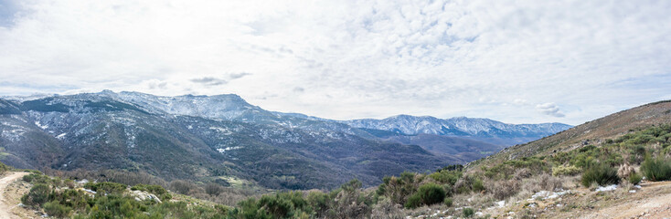 Fototapeta na wymiar Panoramic view of the snowy mountains. Mountain landscape in Spain