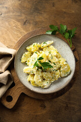 Traditional homemade potato salad with fresh parsley