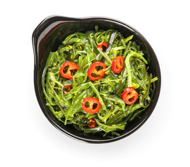 Bowl with healthy seaweed salad on white background