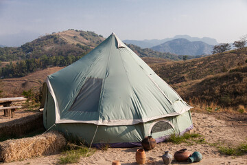 Camping on the him with sky and cloud.