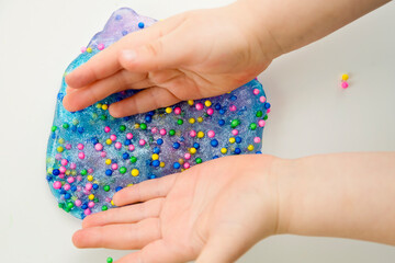 Two-color blue and pink slime. The mucus is crushed, stretched, torn and squeezed by hands. abstract view for background.