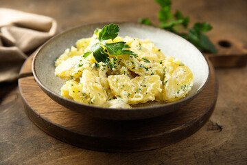 Traditional homemade potato salad with fresh parsley