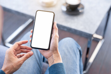 cell phone blank white screen mockup.hand holding texting using mobile on desk at office.background empty space for advertise.work people contact marketing business,technology