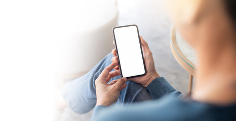 cell phone blank white screen mockup.hand holding texting using mobile on desk at office.background empty space for advertise.work people contact marketing business,technology