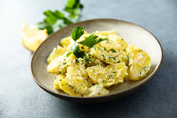 Traditional homemade potato salad with fresh parsley