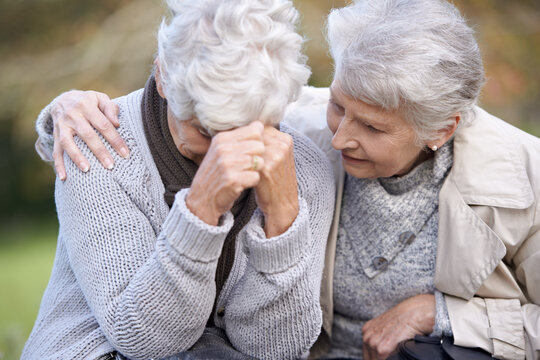 We Are Always There For Each Other. A Senior Woman Consoling Her Friend As They Sit Outdoors.