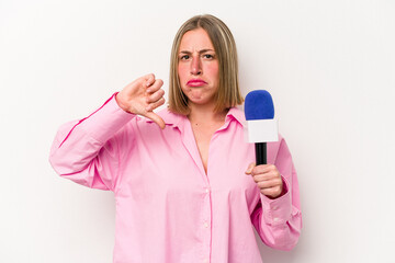 Young caucasian journalist woman isolated on white background showing a dislike gesture, thumbs down. Disagreement concept.