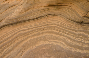 Rock surface showing different strata. Montana Clara. Integral Natural Reserve of Los Islotes. Canary Islands. Spain.