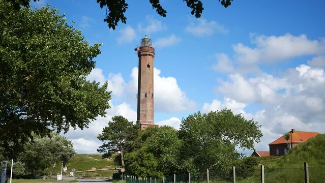 Old lighthouse on the island Norderney. The brick tower is over 150 years old and is a popular tourist attraction.