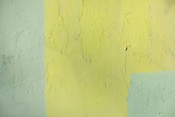 Yellow paint on wall. Texture of wall. Dirty surface.