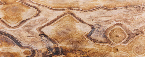 Brown textured background made of natural wood. Creative wooden pattern. Banner.