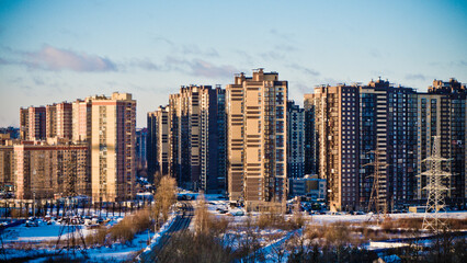 panoramic photo of a residential complex from a height against a blue sky 