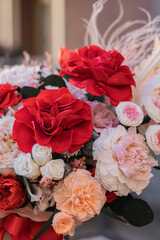 Red rose and peach peonies in a big round box for mother's day, valentine's day, Woman's day 8 march.