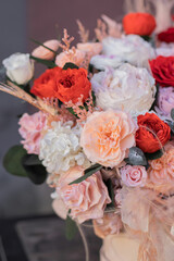 Red rose and peach peonies in a big round box for mother's day, valentine's day, Woman's day 8 march.