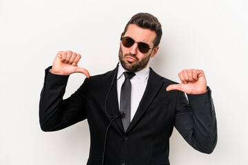 Young caucasian bodyguard man isolated on white background feels proud and self confident, example...