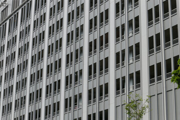 Perspective of the window and balcony of the gray condominium.