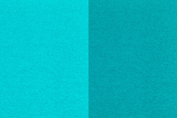 Texture of craft cyan and green paper background, half two colors, macro. Structure of cerulean craft cardboard.