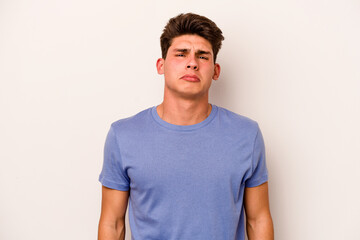 Young caucasian man isolated on white background sad, serious face, feeling miserable and displeased.