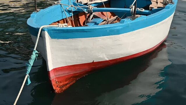 horizontal close up detail old boat in cetara amalfi coast italy europe - harbor boats wood blue red white - relaxed calm pause - nobody no people