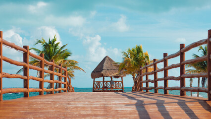 Beautiful view of a gazebo from a pier on a sunny beach