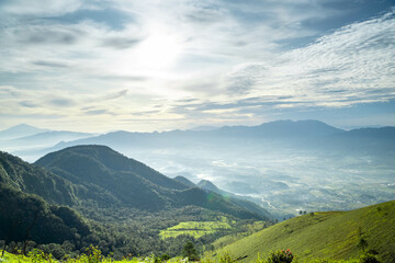 Obraz premium View of Indonesia's mountains with wide green grass