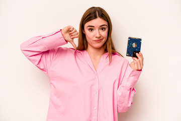 Young informatic caucasian woman isolated on white background showing a dislike gesture, thumbs...