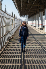 Woman walking on the railway station.